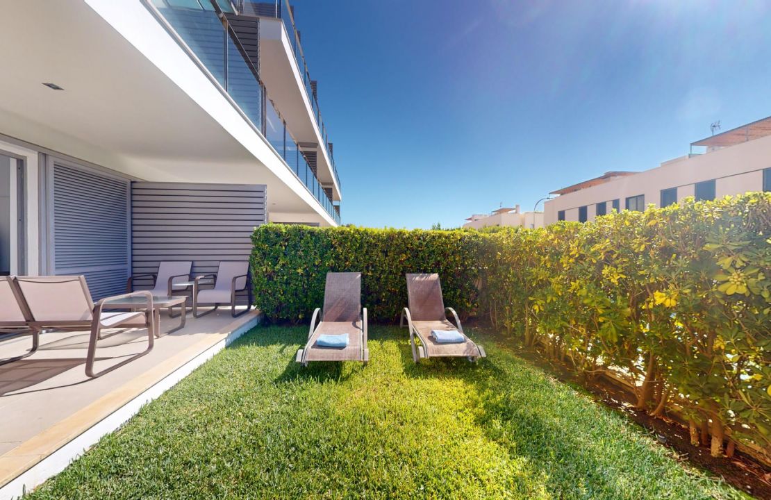 Fabulous ground floor apartment in Puerto Pollensa Mallorca with pool and private garden